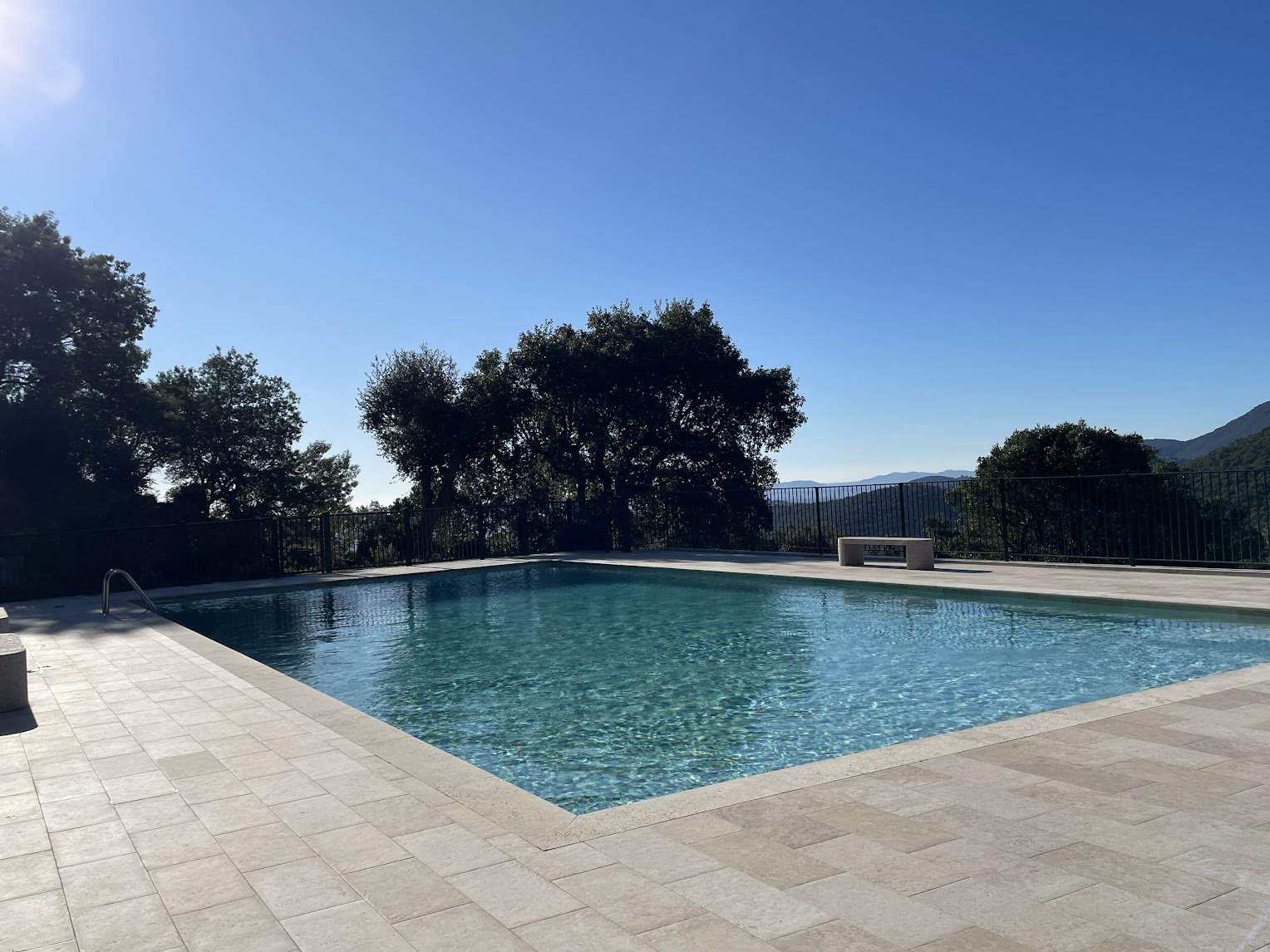 The shared residence pool, three minutes uphill on foot
